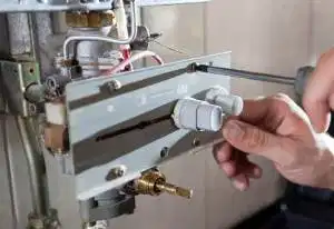 Engineer Repairing a Boiler